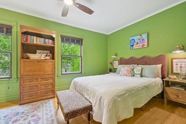 1031 S Humphrey Ave, Oak Park, IL 60304 - bedroom with multiple windows, light wood-style flooring, and crown molding