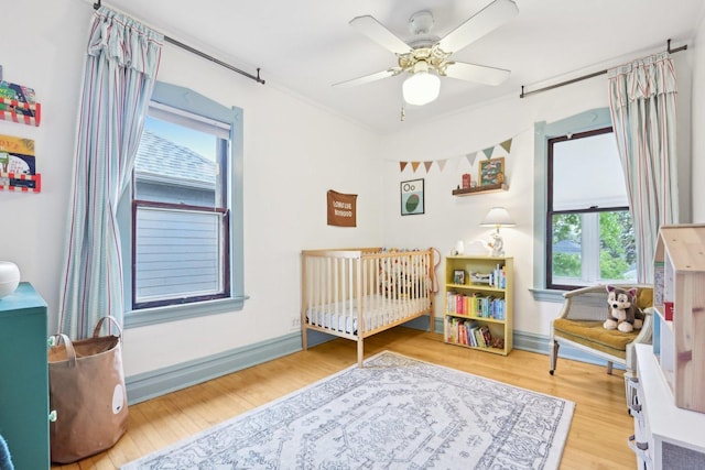 1031 S Humphrey Ave, Oak Park, IL 60304 - bedroom featuring wood finished floors, baseboards, and ceiling fan