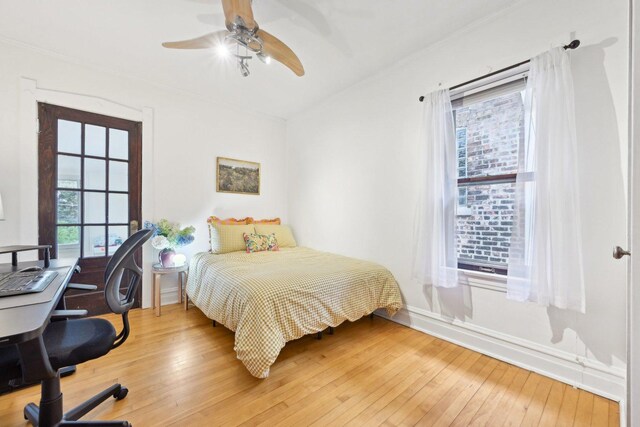 1031 S Humphrey Ave, Oak Park, IL 60304 - bedroom featuring multiple windows, light wood-style floors, ornamental molding, and baseboards