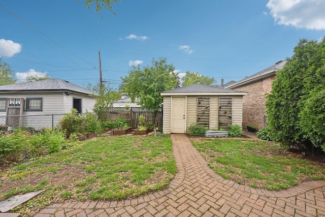 1031 S Humphrey Ave, Oak Park, IL 60304 - view of yard with a vegetable garden and an outbuilding