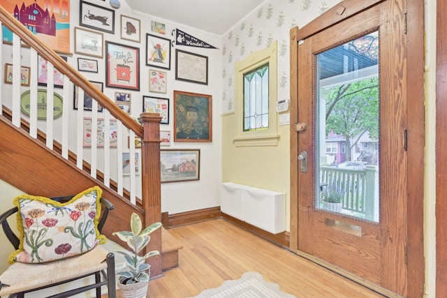 1031 S Humphrey Ave, Oak Park, IL 60304 - entryway with wood finished floors, baseboards, stairs, and crown molding