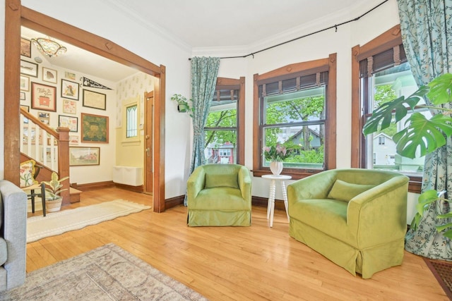 1031 S Humphrey Ave, Oak Park, IL 60304 - living area featuring wood finished floors, stairs, baseboards, and crown molding