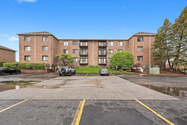 11001 Deblin Ln Unit 307, Oak Lawn, IL 60453 - view of apartment building / complex featuring uncovered parking