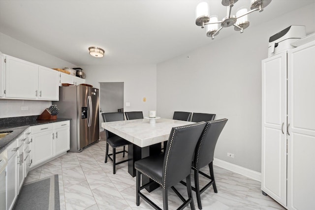11001 Deblin Ln Unit 307, Oak Lawn, IL 60453 - dining area featuring light marble finish floors and a chandelier