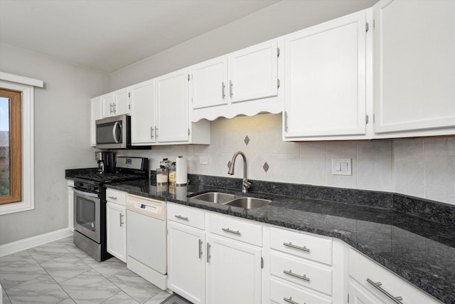 11001 Deblin Ln Unit 307, Oak Lawn, IL 60453 - kitchen featuring appliances with stainless steel finishes, a sink, light marble finish floors, white cabinets, and dark stone countertops