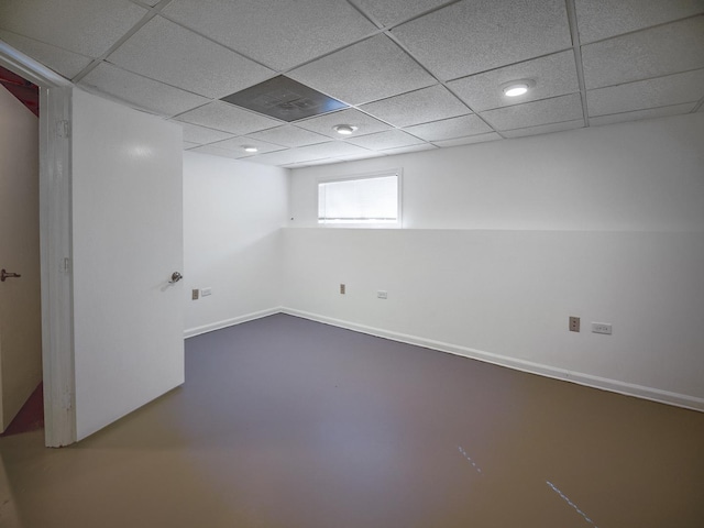 below grade area featuring a drop ceiling and recessed lighting