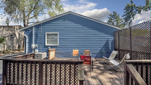 wooden deck with central air condition unit