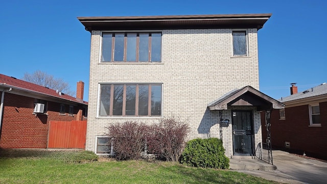 391 Mackinaw Ave, Calumet City, IL 60409 - view of front facade featuring brick siding and fence