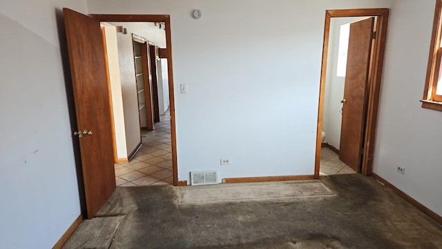 391 Mackinaw Ave, Calumet City, IL 60409 - tiled empty room featuring baseboards