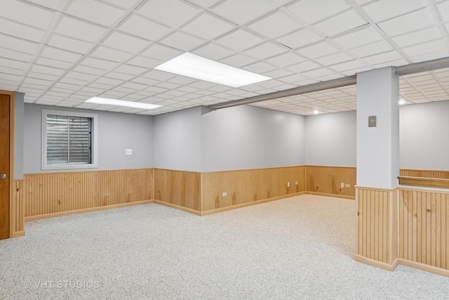 341 Breckenridge Dr, Aurora, IL 60504 - empty room with wainscoting, carpet flooring, wood walls, and a drop ceiling