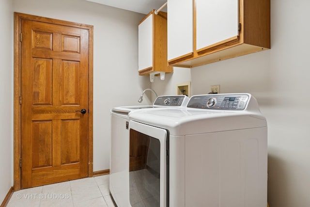 341 Breckenridge Dr, Aurora, IL 60504 - washroom featuring independent washer and dryer, cabinet space, light tile patterned floors, and baseboards