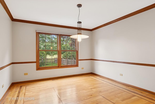 341 Breckenridge Dr, Aurora, IL 60504 - empty room featuring wood finished floors, ornamental molding, and baseboards