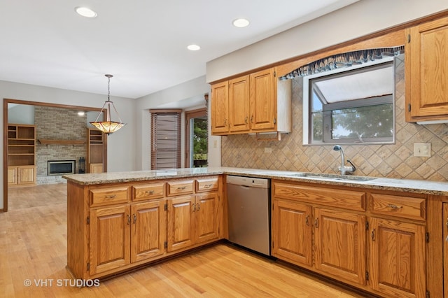 341 Breckenridge Dr, Aurora, IL 60504 - kitchen featuring stainless steel dishwasher, a sink, light wood-type flooring, a peninsula, and recessed lighting