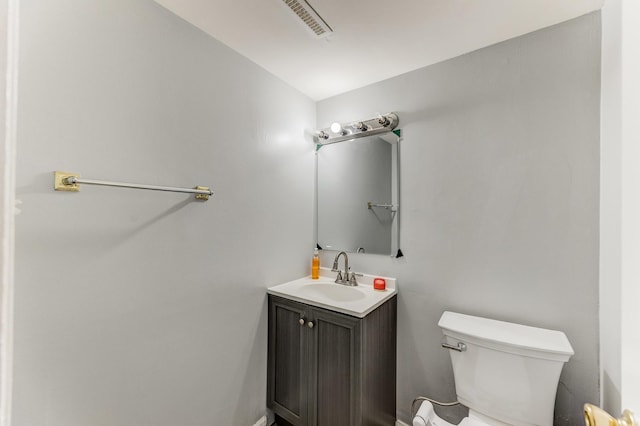 half bath with vanity and toilet