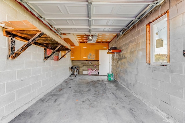 garage with concrete block wall
