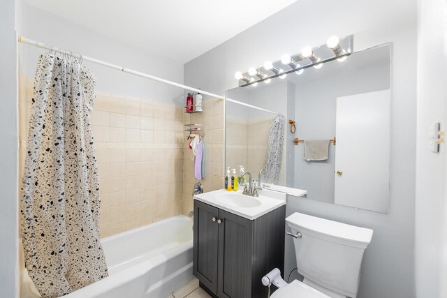 full bathroom with shower / bathtub combination with curtain, vanity, and toilet