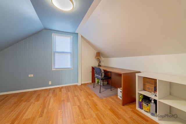 office with light wood-style flooring, lofted ceiling, and baseboards