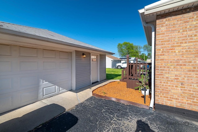garage featuring driveway