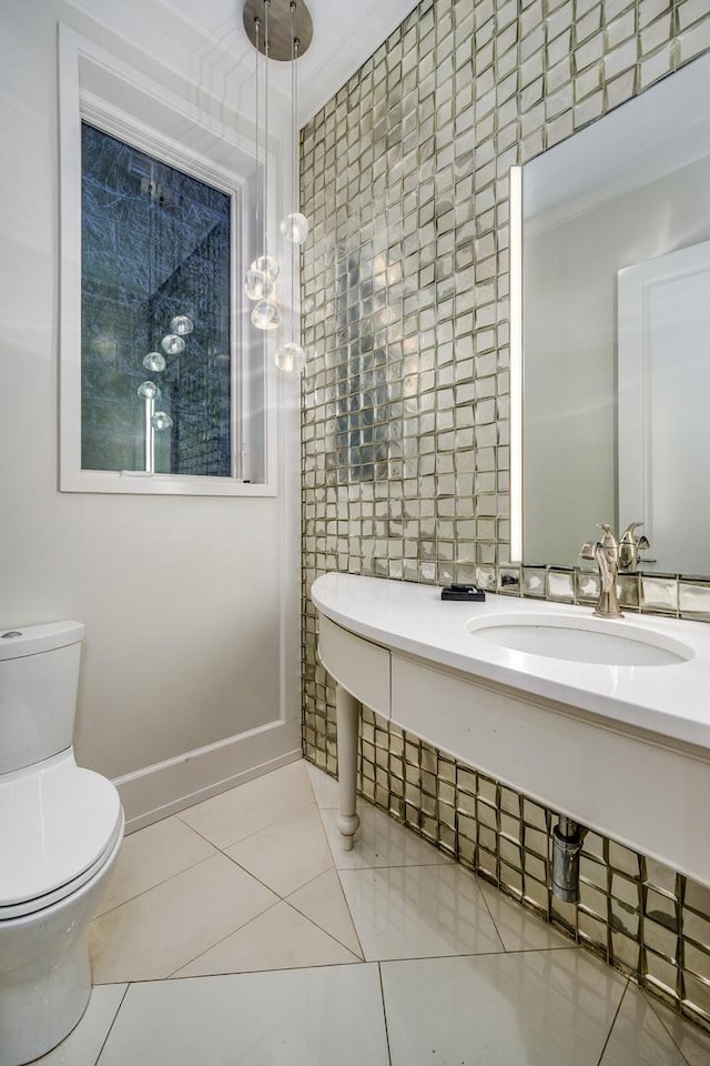 2054 N Mohawk St, Chicago, IL 60614 - bathroom with a sink, toilet, and tile patterned floors