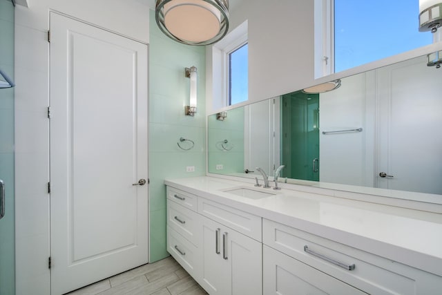 2054 N Mohawk St, Chicago, IL 60614 - full bathroom with vanity, a stall shower, and wood finished floors