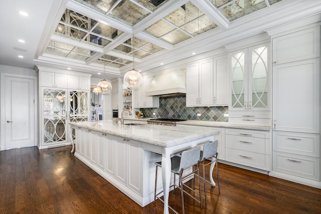 2054 N Mohawk St, Chicago, IL 60614 - kitchen with custom exhaust hood, a sink, white cabinetry, decorative backsplash, and coffered ceiling