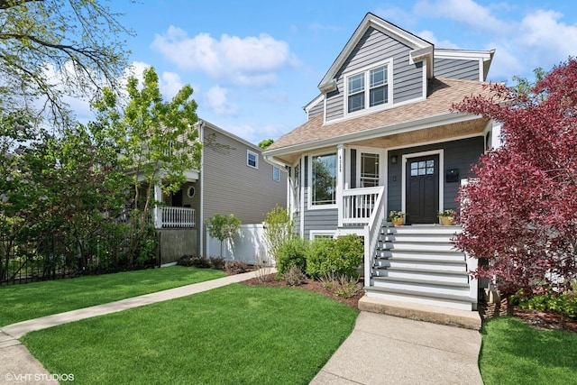 4328 N Ridgeway Ave, Chicago, IL 60618 - view of front facade with roof with shingles and a porch