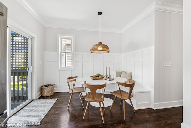 4328 N Ridgeway Ave, Chicago, IL 60618 - dining room with breakfast area, a decorative wall, ornamental molding, dark wood-style flooring, and wainscoting