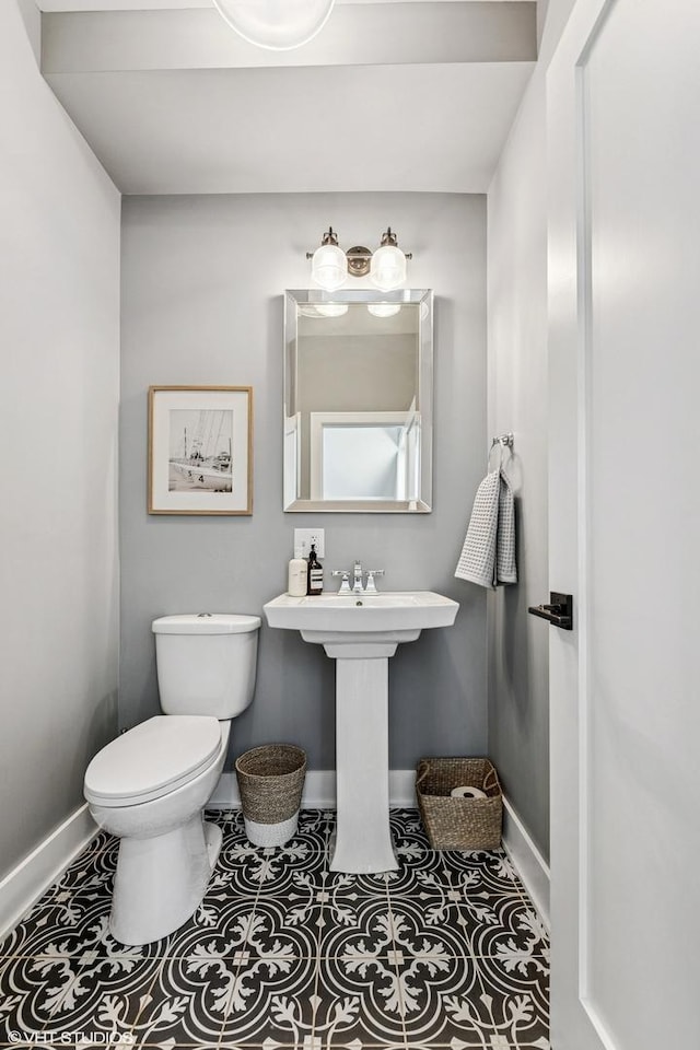 4328 N Ridgeway Ave, Chicago, IL 60618 - half bathroom featuring baseboards, toilet, and tile patterned flooring
