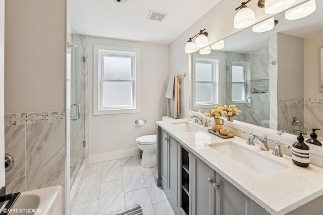 4328 N Ridgeway Ave, Chicago, IL 60618 - bathroom with a stall shower, toilet, double vanity, and marble finish floors