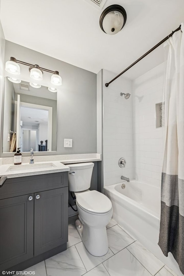 4328 N Ridgeway Ave, Chicago, IL 60618 - full bath with marble finish flooring, vanity, shower / bath combo, and toilet