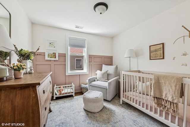 4328 N Ridgeway Ave, Chicago, IL 60618 - bedroom featuring a decorative wall and a wainscoted wall
