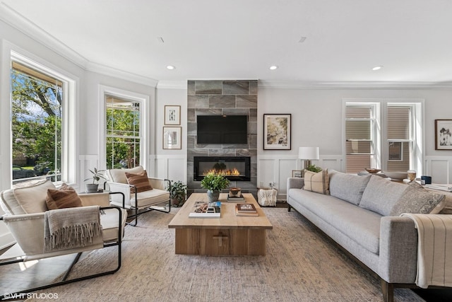 4328 N Ridgeway Ave, Chicago, IL 60618 - living room with a decorative wall, ornamental molding, a tile fireplace, wainscoting, and recessed lighting
