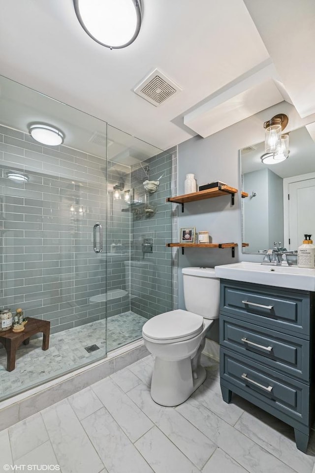 4328 N Ridgeway Ave, Chicago, IL 60618 - bathroom with marble look tiles, toilet, vanity, and a shower stall