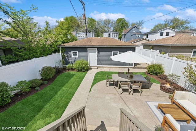 4328 N Ridgeway Ave, Chicago, IL 60618 - back of house featuring an outdoor fire pit, a patio, outdoor dining space, and an outdoor structure