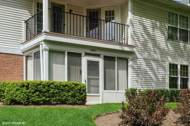 803 Persimmon Ln Unit A, Mount Prospect, IL 60056 - view of property exterior with a balcony and brick siding