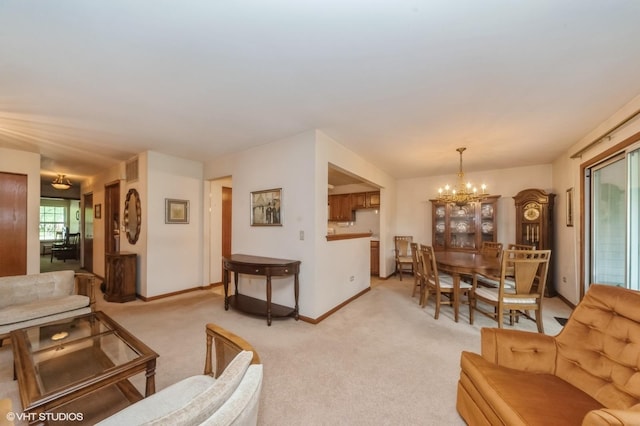 803 Persimmon Ln Unit A, Mount Prospect, IL 60056 - living room featuring a chandelier, light colored carpet, and baseboards