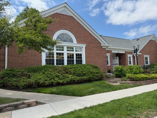803 Persimmon Ln Unit A, Mount Prospect, IL 60056 - view of front of property featuring brick siding and a front yard