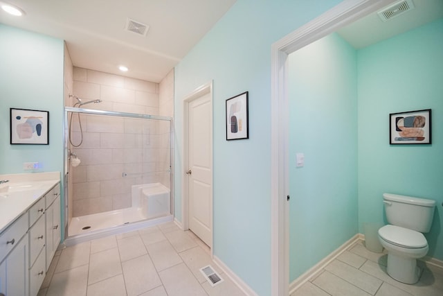 full bath with tile patterned floors, a shower stall, toilet, vanity, and recessed lighting