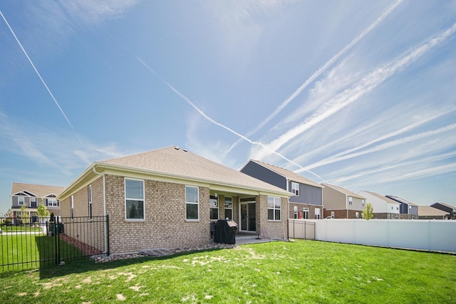 rear view of house featuring brick siding and a residential view