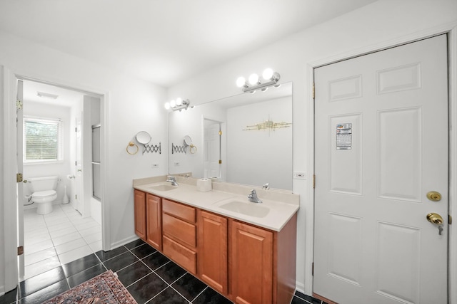 full bath with tile patterned floors, toilet, a shower with door, and double vanity