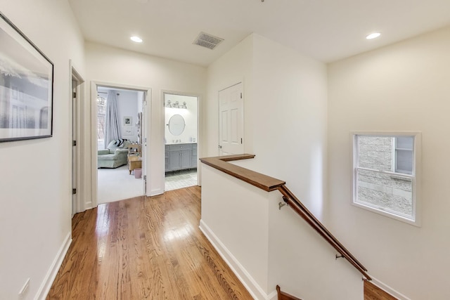 19 W 15th St, Chicago, IL 60605 - hallway with an upstairs landing, light wood finished floors, recessed lighting, and baseboards