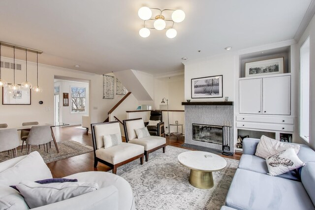 19 W 15th St, Chicago, IL 60605 - living room with wood finished floors, crown molding, and a tile fireplace