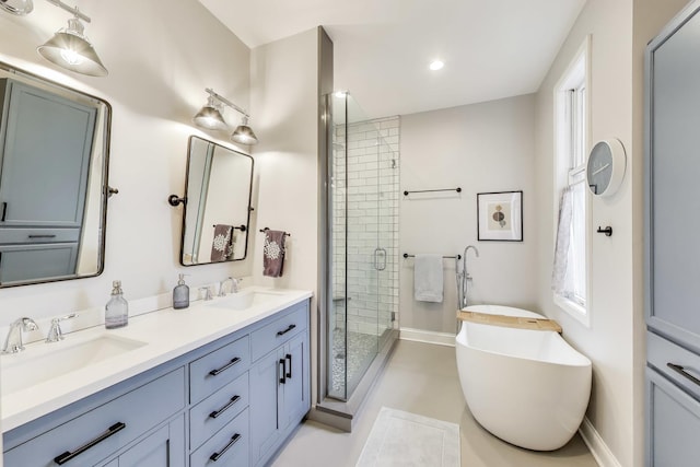 19 W 15th St, Chicago, IL 60605 - full bath with a stall shower, double vanity, a freestanding bath, recessed lighting, and baseboards