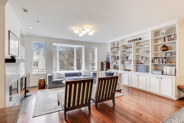 19 W 15th St, Chicago, IL 60605 - sitting room with ornamental molding, a fireplace, and light wood finished floors