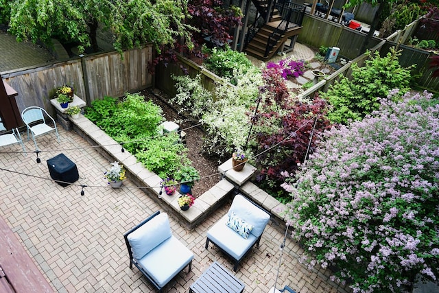 19 W 15th St, Chicago, IL 60605 - view of patio with a fenced backyard and a garden