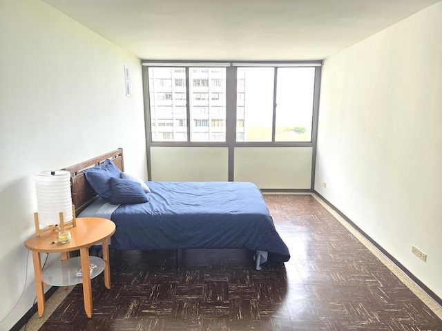 bedroom featuring baseboards