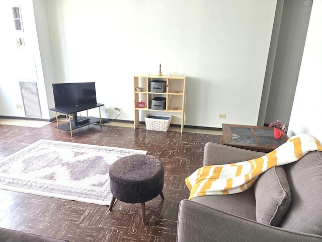 living area featuring baseboards