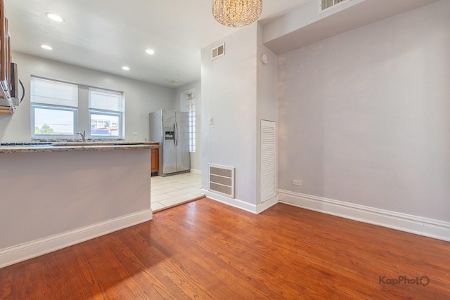 4006 W Nelson St Unit 6A, Chicago, IL 60641 - unfurnished room with baseboards, light wood-style flooring, recessed lighting, and a sink