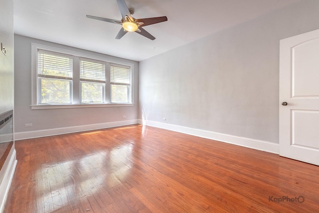 4006 W Nelson St Unit 6A, Chicago, IL 60641 - spare room featuring wood finished floors, ceiling fan, and baseboards