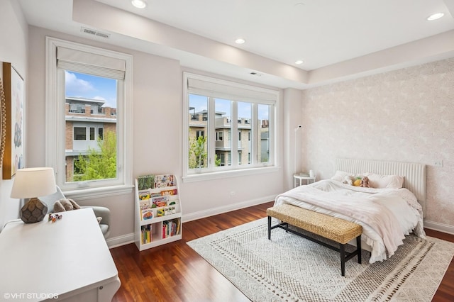 bedroom featuring multiple windows, baseboards, dark wood finished floors, and recessed lighting